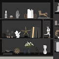 Interior Decorative Ornament Set On Dark Bookshelf With Sculptures Vases Books And Starfish