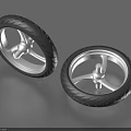 Two Black Tires With Silver Rims And Spokes For Household Daily Use Items