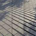 Geometric Brick Ground Design With Gravel Filled Joints And Natural Shadows