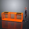 Elderly man in suit standing beside orange grid cabinet with black countertop areas