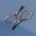 Two Brown And Beige Tennis Rackets With Beige Frames Brown Handles On Blue Background