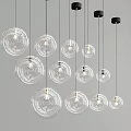Modern Transparent Glass Globe Pendant Lights with Exposed Bulbs Various Sizes Hanging on Gray Background