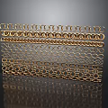 Golden Metal Mesh Equipment With Layered Chain Ring Patterns Shiny Surface And Black Reflection