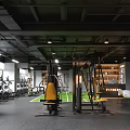 Modern Gym Interior With Multiple Fitness Machines And Seating Area