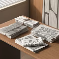 Several Stacks of Magazines Tied with String Arranged on Wooden Table with Geometric Wall Design