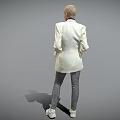 Bald Woman Wearing Beige Blazer Black Turtleneck Gray Pants White Shoes Standing Against Gray Background