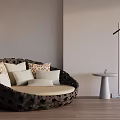Dark Round Outdoor Chair with Hollow Design Light Cushions and Small Table in Minimalist Space