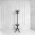 Elegant Black Metal Coat Rack With Multiple Hooks And Decorative Base In Modern Interior Space 3d model
