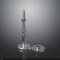 Elegant Silver Candlestick With White Candle And Round Base Design