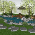 Lush Garden Water Fountain with Lily Pads Stone Path and Willow Trees