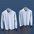 Two White Shirts Hanging On Wooden Hangers Against Dark Blue Background