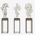 Three White Stone Sculptures On Dark Wooden Stands For Interior Display Decoration