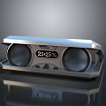 Modern Silver Speaker Device With Dual Round Speakers Digital Display And 2525 Readout