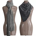 Fashionable Gray Knit Scarves Displayed On Wooden Mannequins With Various Designs