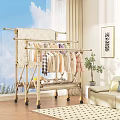 Sturdy Clothes Drying Rack With Hanging Clothes In Living Room Interior