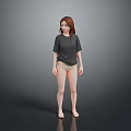 Woman In Gray T-shirt And Underwear Standing Barefoot Against Gray Background