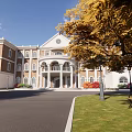 Elegant Classical Building with Red Bricks White Walls Porch Columns Autumn Trees Lawn and Bench