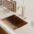 Stainless Steel Kitchen Sink With Gold Faucet On Marble Countertop In Modern Kitchen