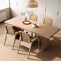 Modern Wooden Dining Table Set With Rattan Back Chairs Green Cushions Vase And Open Book