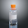 Transparent Glass Bottle With Cork Stopper White Label And Black Granules Inside