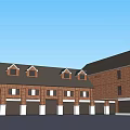 Brick Commercial Street With Multiple Shops Gabled Roofs And Storefront Awnings