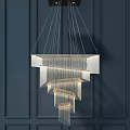 Modern Crystal Chandelier With Multi Layered Metal Frame Transparent Crystal Panels Hanging On Dark Wall