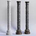 Three Ornate Columns With Intricate Carved Patterns White And Dark Colored Bases