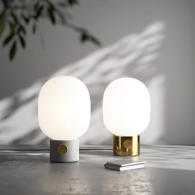 White Globe Table Lamps With Grey And Gold Bases On Grey Desk With Small Book 3d model