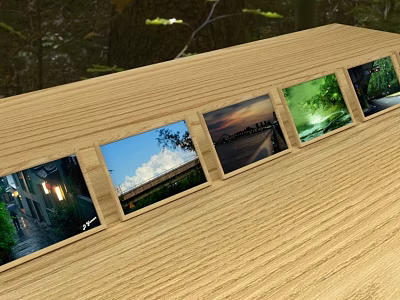 Multiple Photo Frames On Wooden Table Displaying Scenic Landscape 3d model