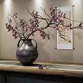 Chinese Style Interior Decor Featuring Vase With Branches Pink Flowers And Scroll Painting