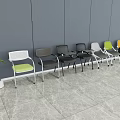 Modern Office Chairs With Various Colors And Wheels In Office Setting