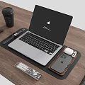 Apple MacBook Laptop Home Office Setup With Accessories On Wooden Desk