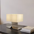 Modern Coffee Table With Black Tabletop Metal Base Table Lamp And Books