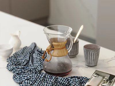 Elegant Tableware Set With Glass Coffee Pot Bamboo Accents And Checkered Cloth On Marble Countertop 3d model