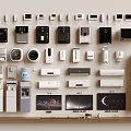 Various Types Of Modern Kitchen Appliances Arranged On Wall And Shelf