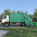 Green Garbage Utility Vehicle with Different Colored Recycling Bins in Outdoor Setting with Trees and Grass
