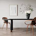 Elegant Black Dining Table Set with Wooden Armchairs Gray Cushions and Flower Vase