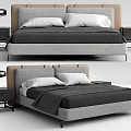 Modern Double Bed With Gray Beige Headboard White Pillows Dark Blanket Black Nightstands Table Lamps