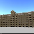 Multi Story Cream Colored School Building With Balconies Numerous Windows And Decorative Top