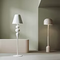 Two Modern Floor Lamps Featuring Spiral And Beaded Stand Designs For Home Decor