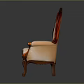 Antique Carved Wooden Chair With Light Colored Fabric And Floral Pattern