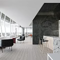 Modern Break Room With Large Windows Scenic View Black Chairs Bar Stools And Marble Countertop