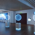 Modern Exhibition Hall With White Display Counter And Black Devices On World Map Wall