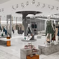 Modern Clothing Store Interior With Mannequins Hanging Clothes Display Platforms And Spotlights