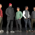 Five Men Standing Together In Different Casual Outfits On Black Background