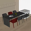 Modern Dining Table Black Red Chairs Open Book Fruit Bowl in Bright Room
