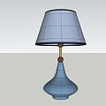 Minimalist Table Lamp With Light Blue Base And Light Purple Fabric Lampshade