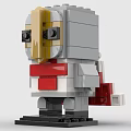 Brick Figure With Gold Gray Head Black Eyes Red White Body Red Cape And Base