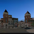 Commercial Street Red Brick Buildings With Clock Towers Glass Facades Pedestrians Cars And Blue Sky