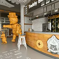 Teddy Bear Themed Restaurant Interior With Wooden Bear Figures Bar Counter And Stools